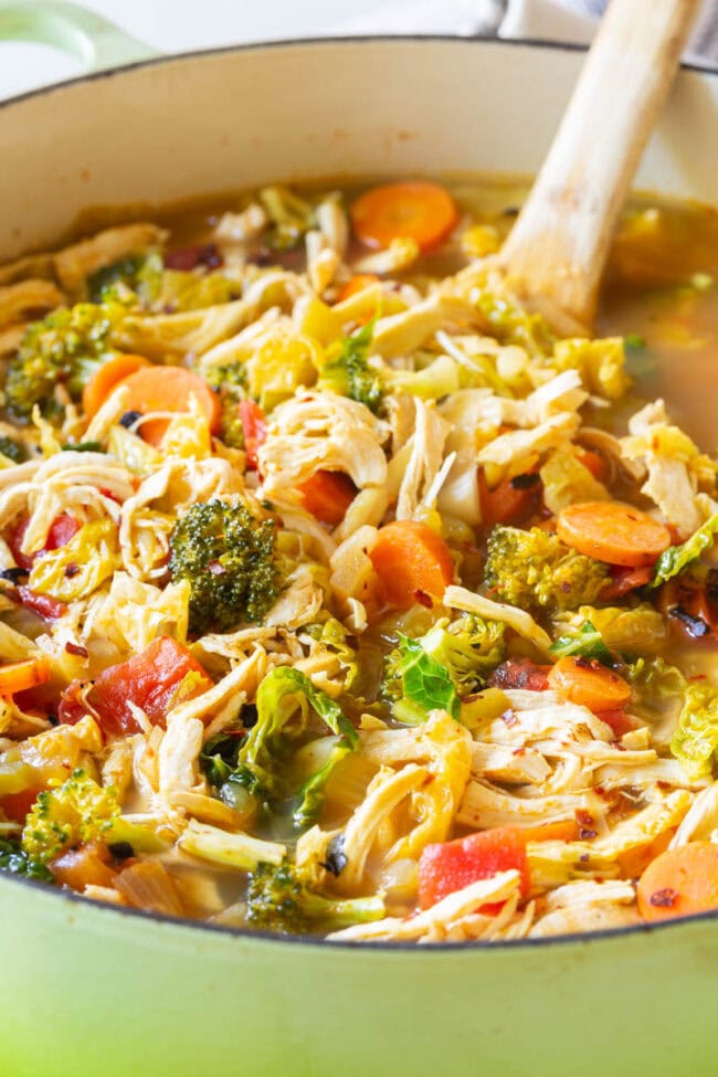 Detox chicken soup with lots of fresh veggies in a pot. 