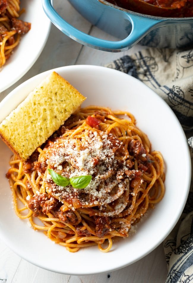 best meat sauce recipe over head shot in bowl with spaghetti