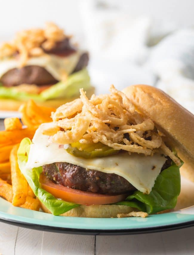 Cowboy Burger Recipe  shown open face with lots of fried onions