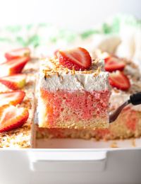 Strawberry-Colada Jello Poke Cake Recipe #ASpicyPerspective #cake #poke #jello #southern #strawberry #pineapple #coconut #pinacolada #holiday #easter #summer #dessert