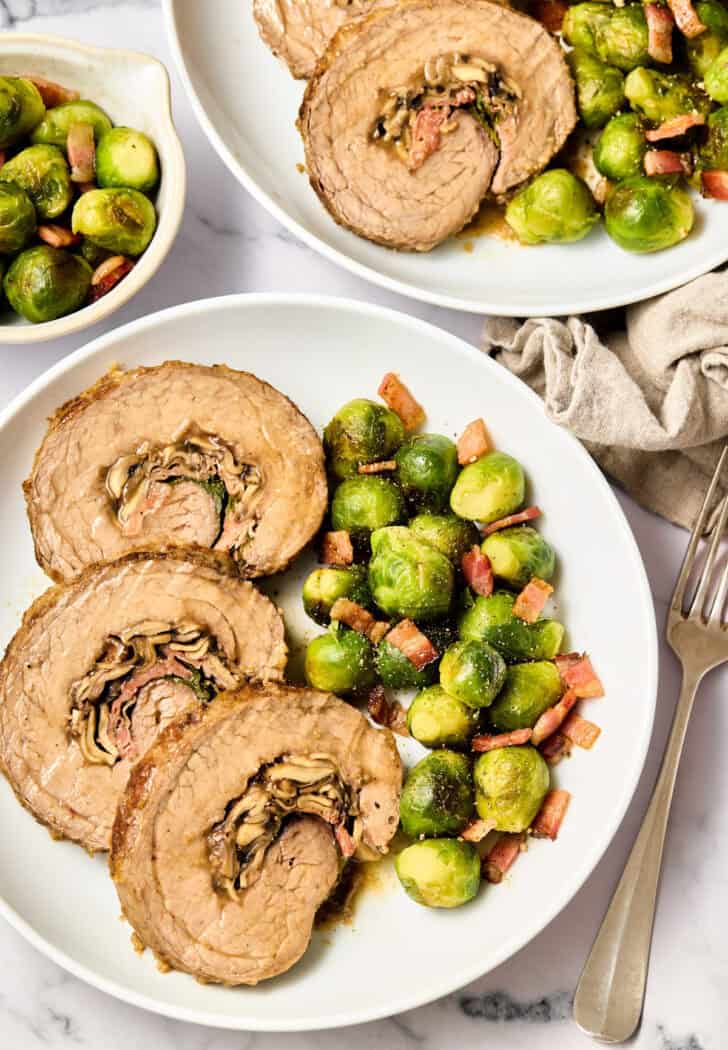 Stuffed Beefk Steak with Cheese, Mushrooms, and Prosciutto overhead shot on plate with brussels sprouts