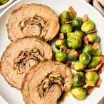 Amazing Stuffed Flank Steak Recipe with Prosciutto and Mushrooms on plate