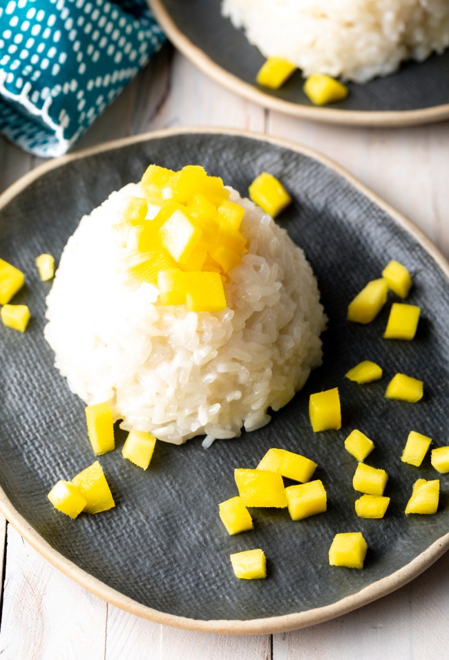 thai mango sticky rice recipe - coconut rice pudding with mangoes on top