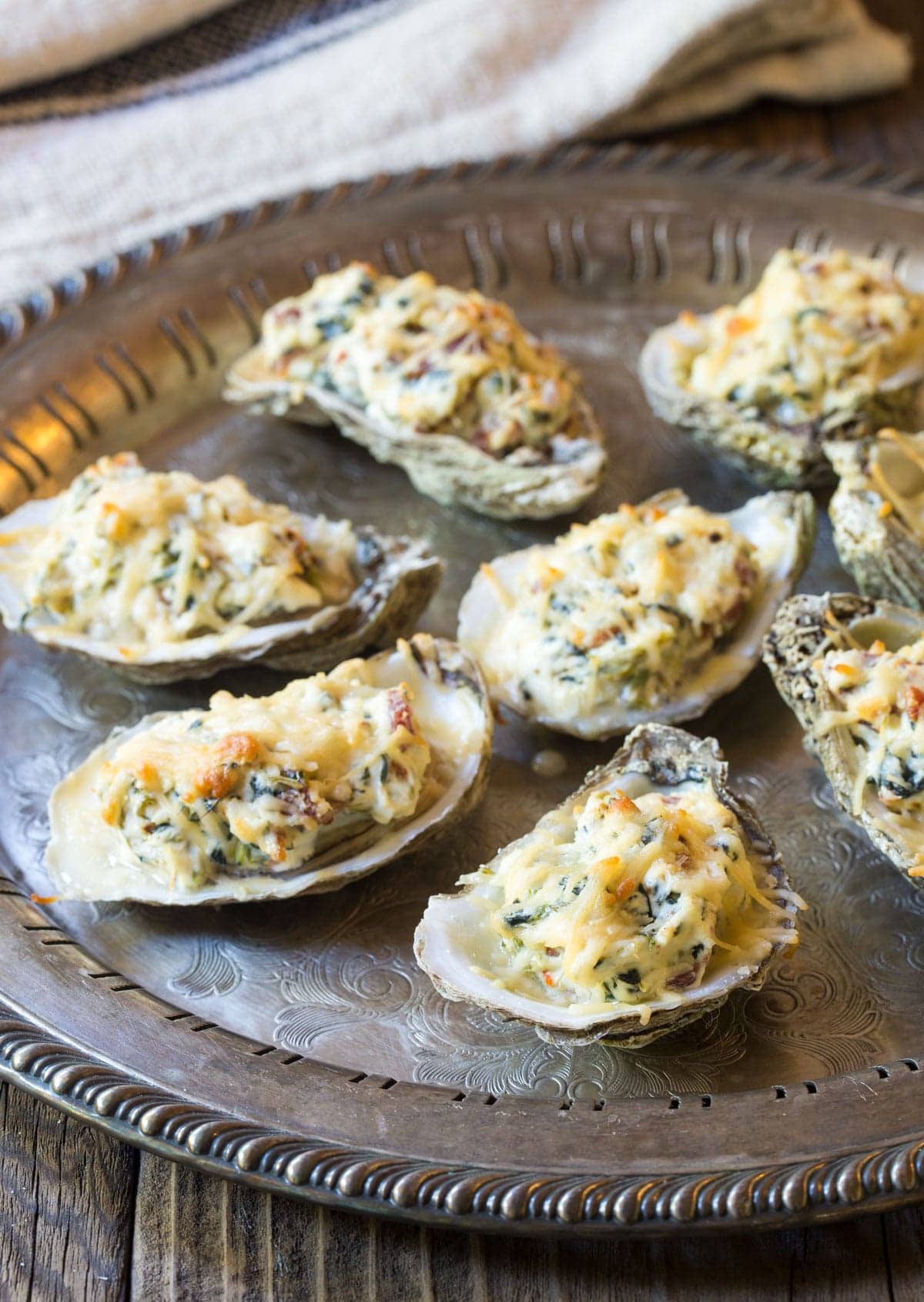 Best Baked Oysters Recipe on a tray with melted cheese on top