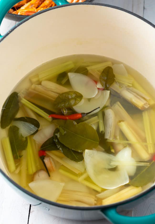 Simmering the broth for how and sour soup in a dutch oven. 