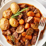 Venison Bourguignon in a white bowl.