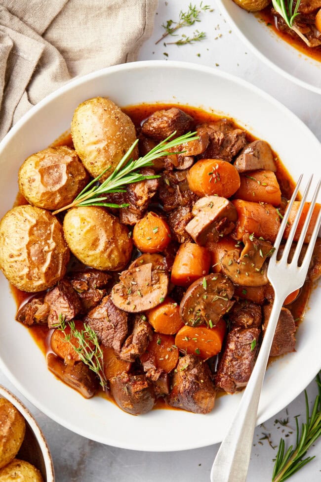 Venison Bourguignon (Deer Stew Recipe) in a white bowl. 