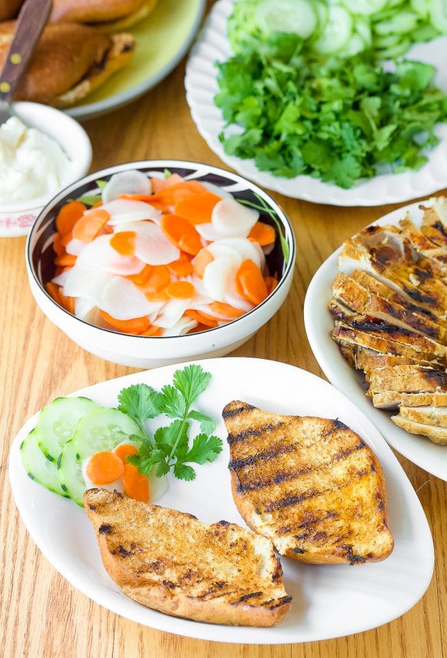 banh mi sandwich recipe with grilled bread on plates - ready for toppings